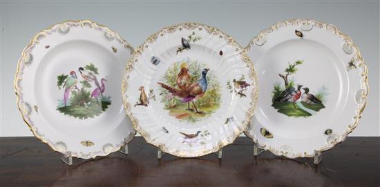 Two Meissen outside decorated plates and a similar Berlin outside decorated plate, 21.5cm